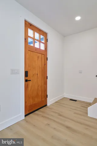 a kitchen with a sink appliances and cabinets