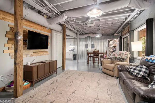 a view of a dining room with furniture window and outside view
