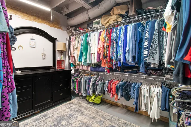 a bathroom with a toilet sink a mirror and vanity