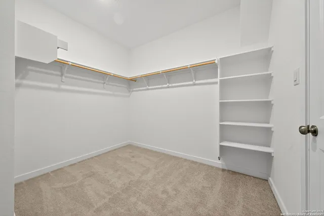a view of an empty walk in closet