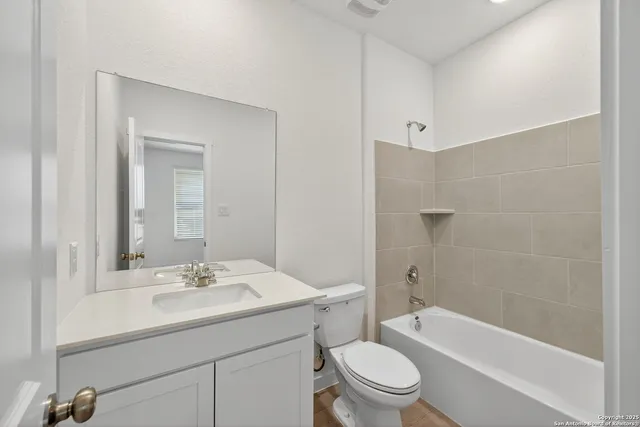 a bathroom with a sink shower bathtub and a toilet