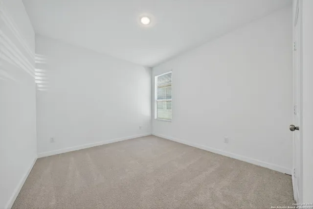 an empty room with a empty space and window