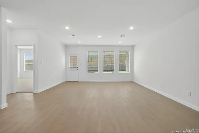 an empty room with windows