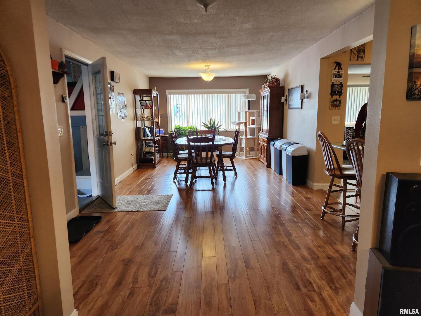 15766 East Tilton Road Ina, IL 62846 - Photo 17 of 59 a living room with furniture and a wooden floor