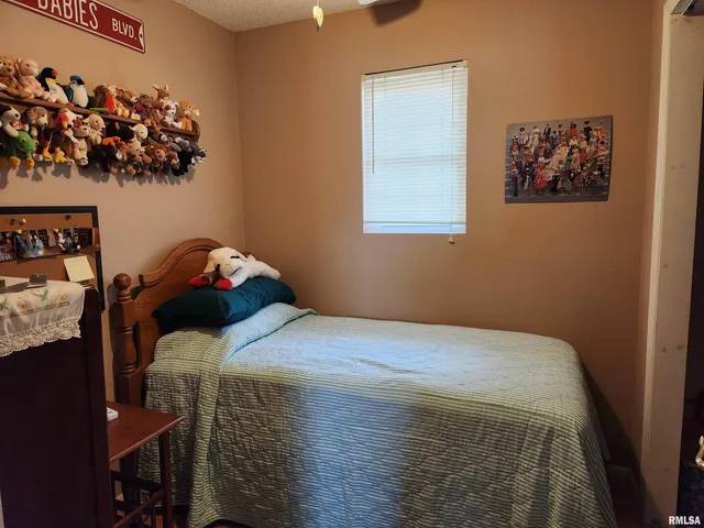 a view of a workspace with furniture and toys