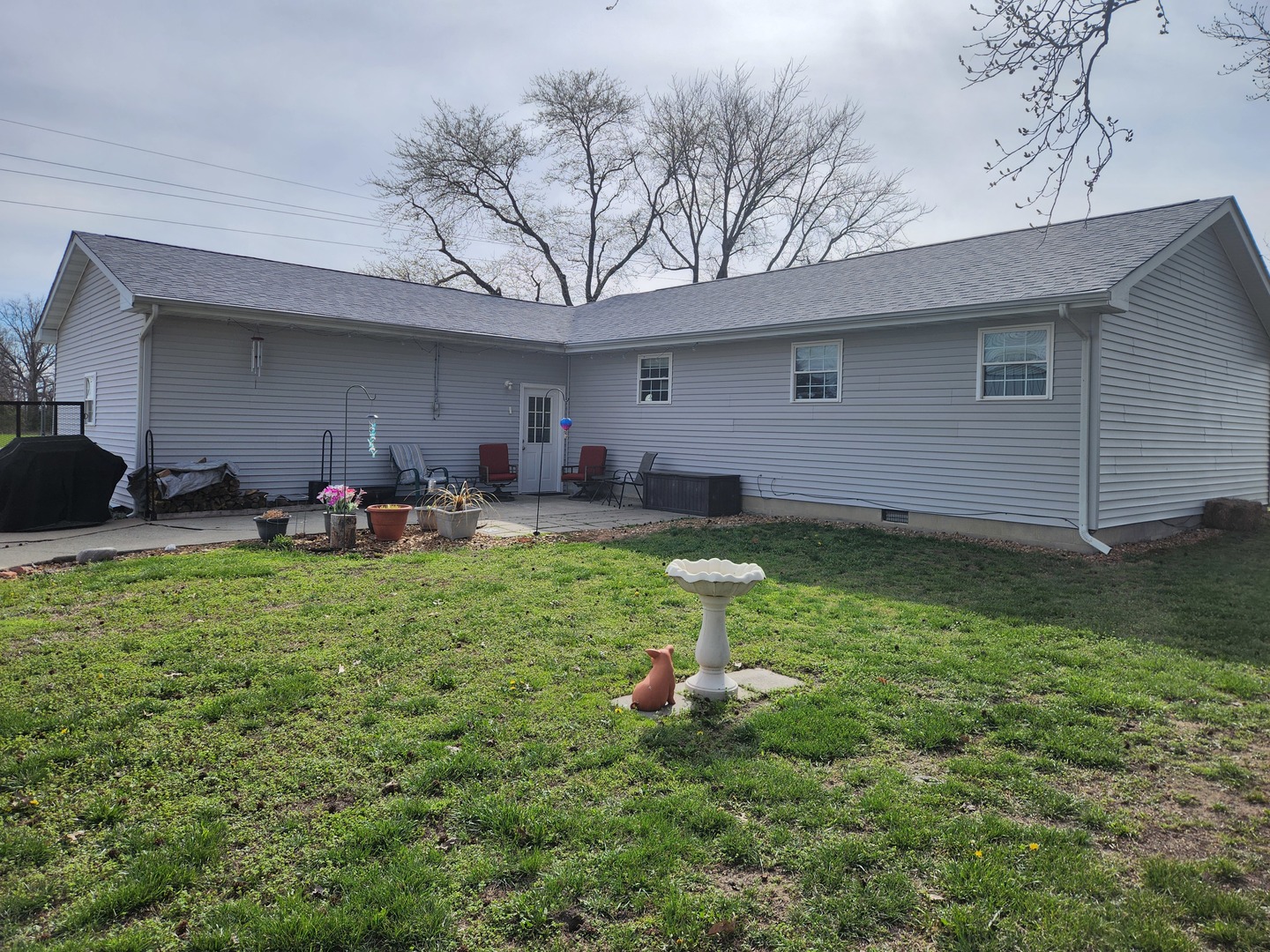 15766 East Tilton Road Ina, IL 62846 - Photo 56 of 59 a backyard of a house with table and chairs