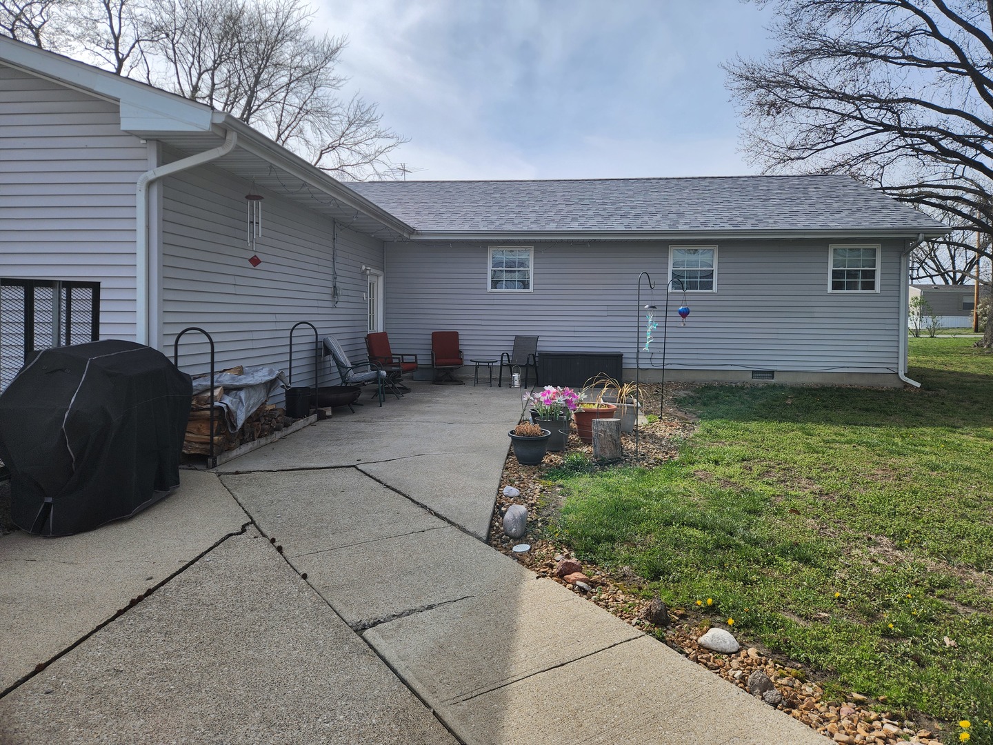15766 East Tilton Road Ina, IL 62846 - Photo 57 of 59 a backyard of a house with yard and outdoor seating