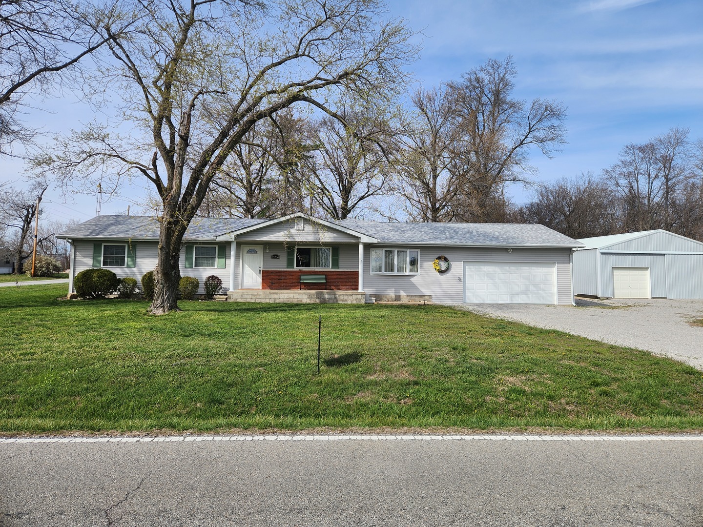 15766 East Tilton Road Ina, IL 62846 - Photo 58 of 59 a front view of a house with a yard