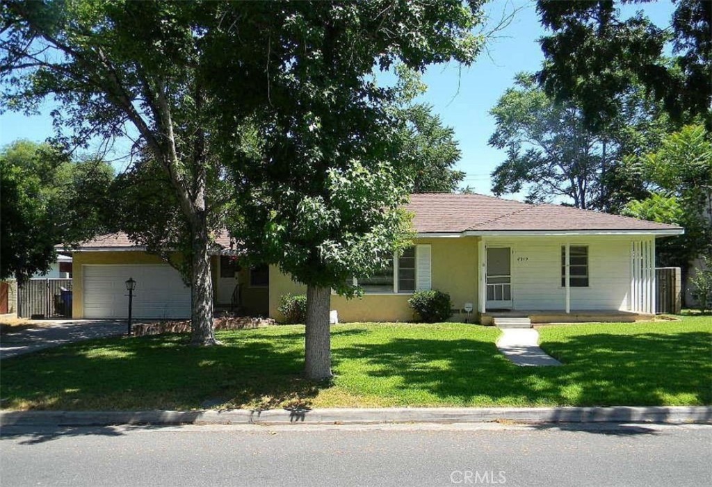 4919 Luther Street Riverside, CA 92504 - Photo 1 of 1 a front view of house with yard and green space