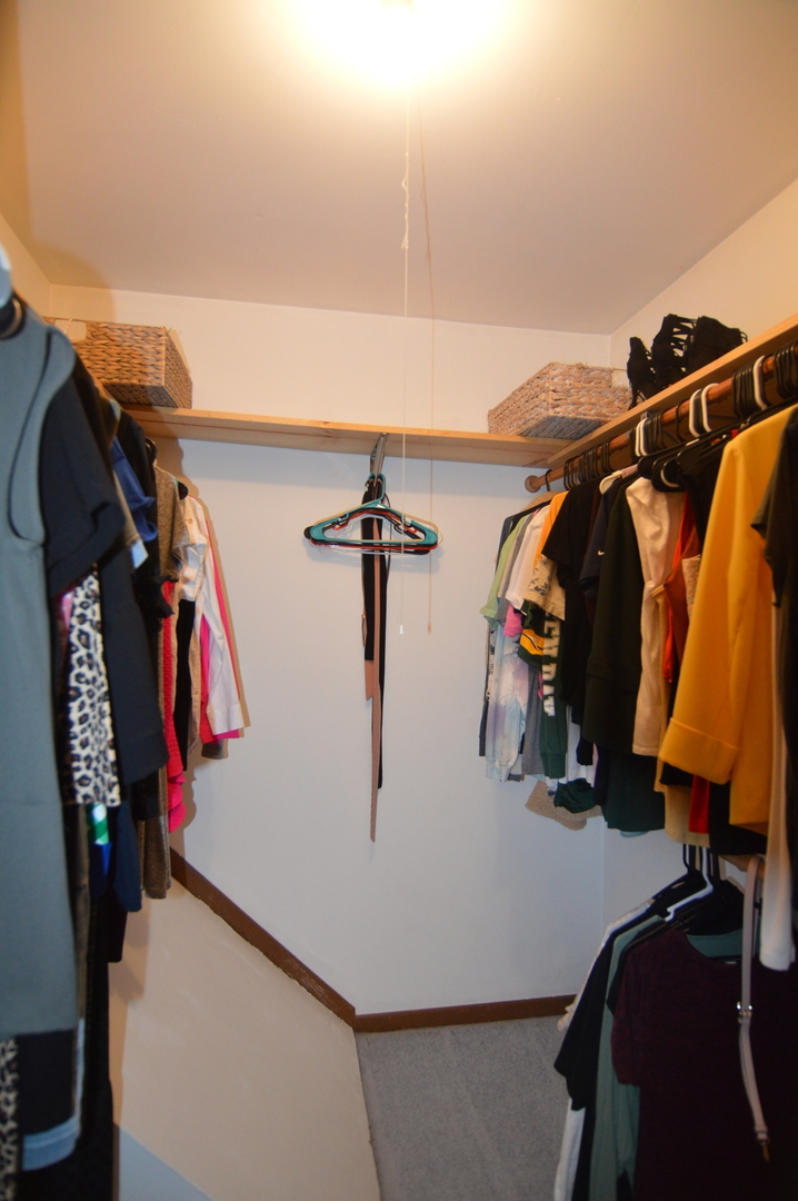 730 Nantucket Way Island Lake, IL 60042 - Photo 24 of 29 a view of walk in closet with clothes and shoes