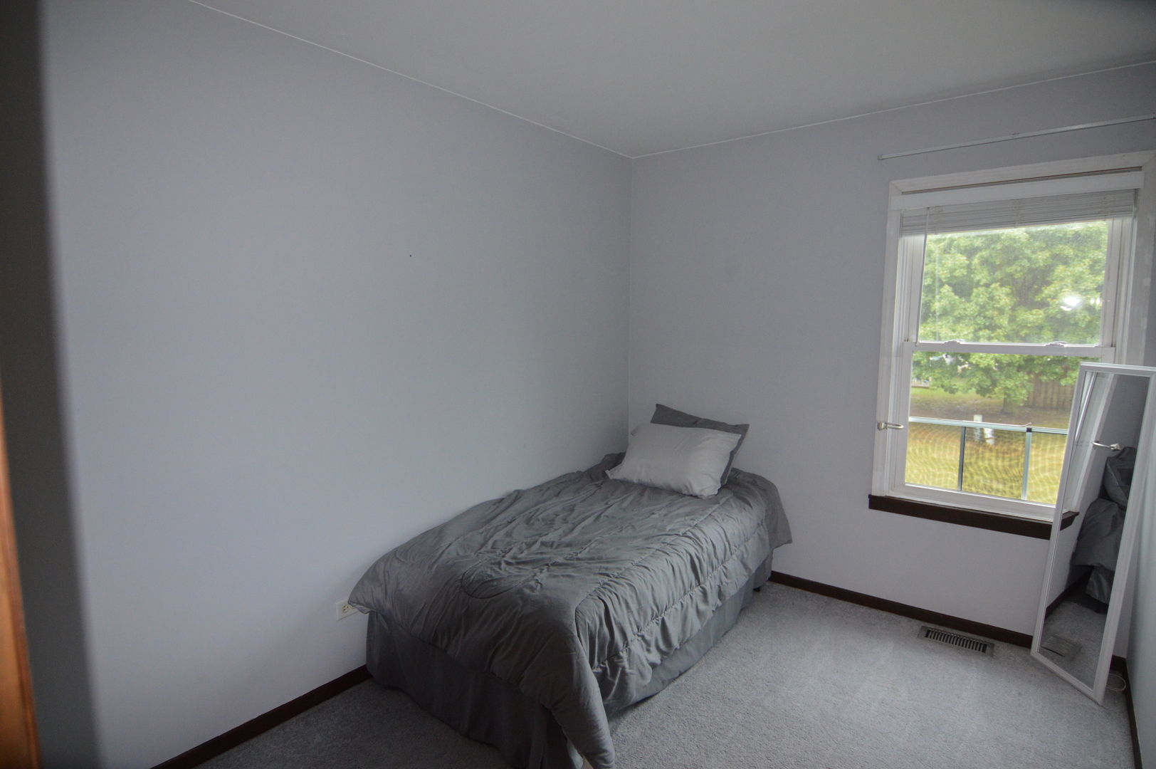730 Nantucket Way Island Lake, IL 60042 - Photo 25 of 29 a bedroom with a bed and a window