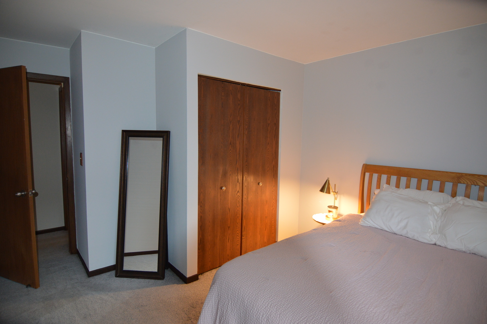 730 Nantucket Way Island Lake, IL 60042 - Photo 27 of 29 a bedroom with a bed and a painting on the wall