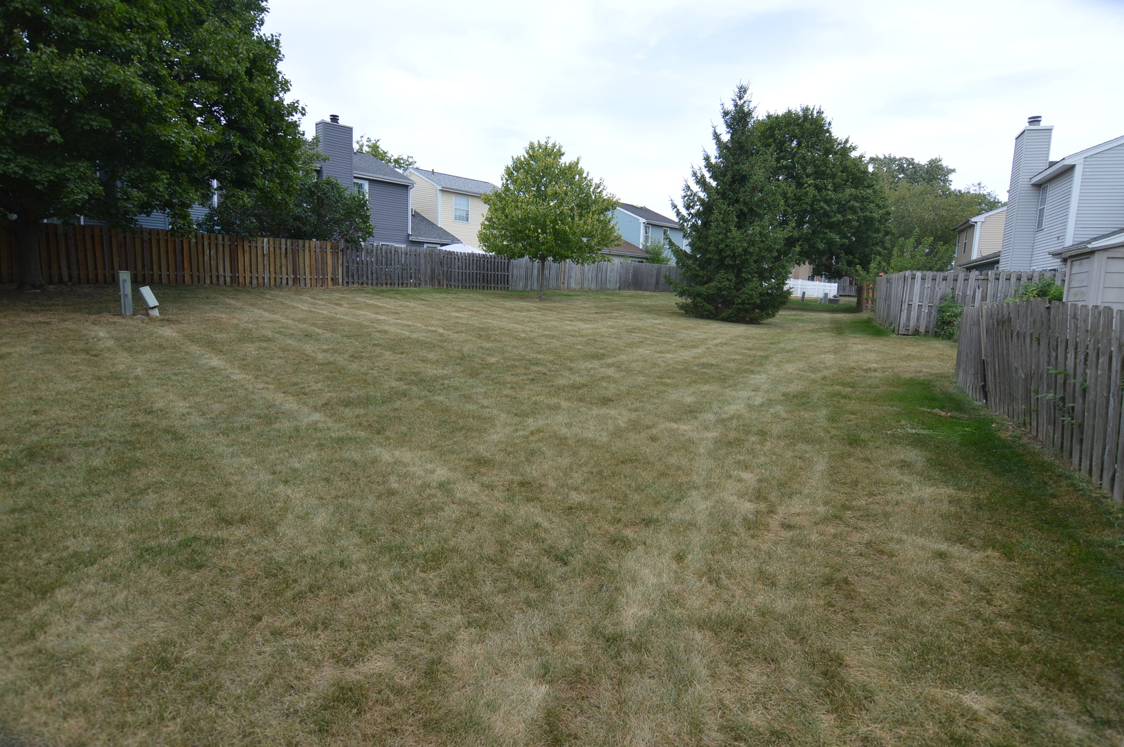 730 Nantucket Way Island Lake, IL 60042 - Photo 28 of 29 a backyard of a house with lots of green space