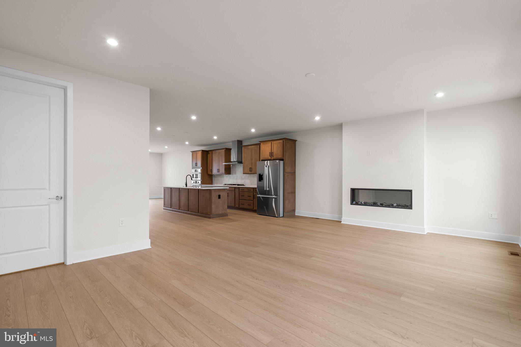 44480 Lowestoft Square Ashburn, VA 20147 - Photo 13 of 44 a view of a kitchen with a sink and a refrigerator