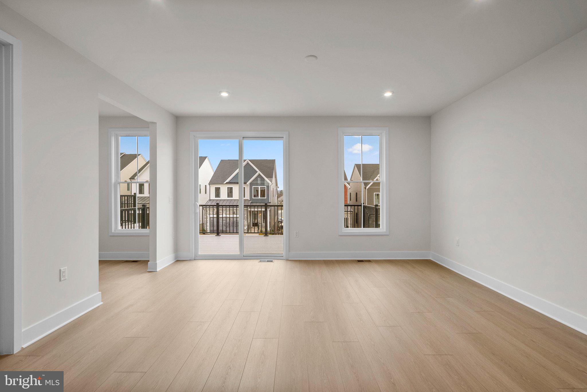 44480 Lowestoft Square Ashburn, VA 20147 - Photo 16 of 44 a view of empty room with wooden floor and fan