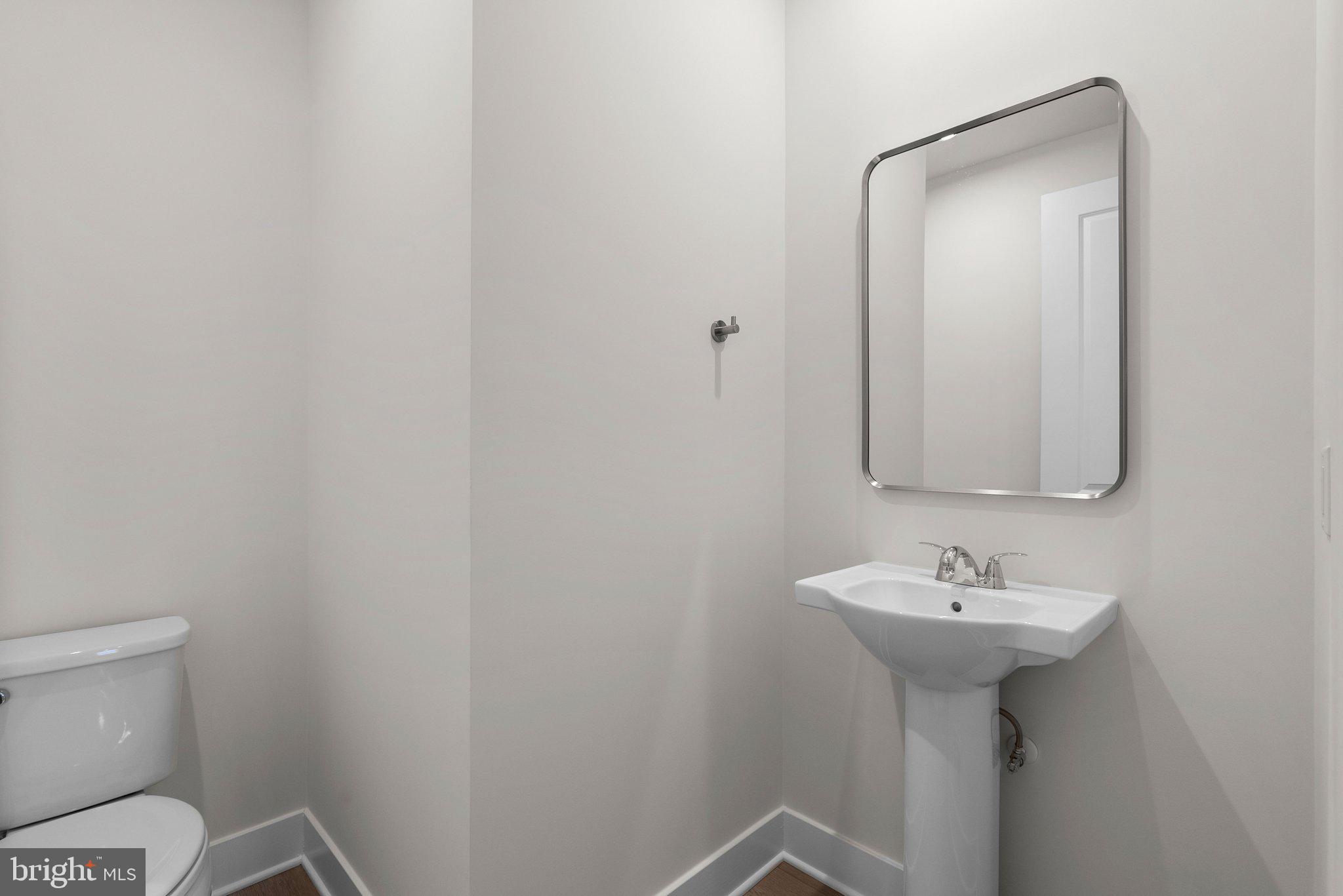 44480 Lowestoft Square Ashburn, VA 20147 - Photo 19 of 44 a bathroom with a sink toilet and mirror