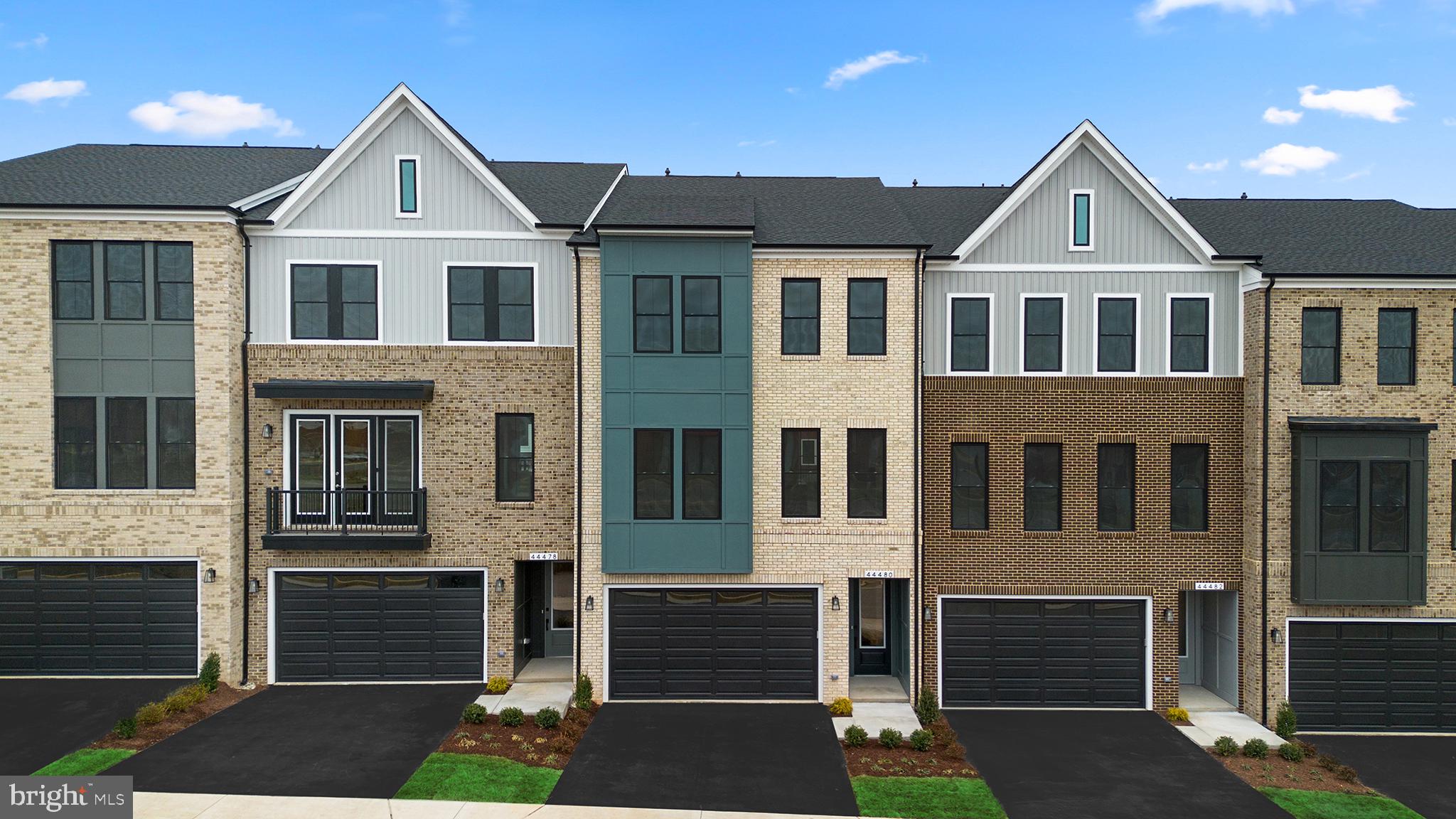 44480 Lowestoft Square Ashburn, VA 20147 - Photo 2 of 44 a front view of a house with a yard and garage