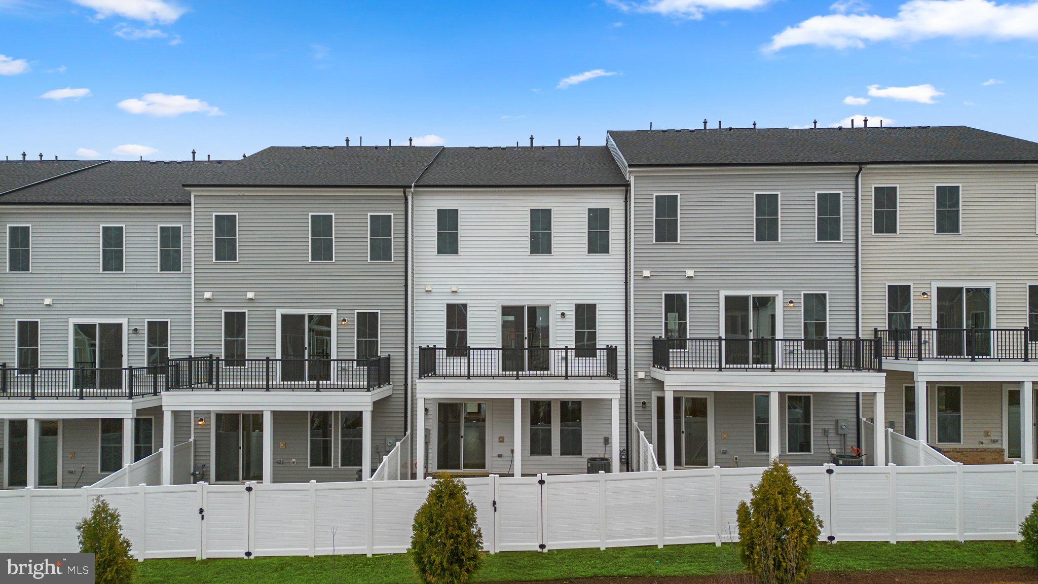 44480 Lowestoft Square Ashburn, VA 20147 - Photo 30 of 44 a front view of a building with a garden