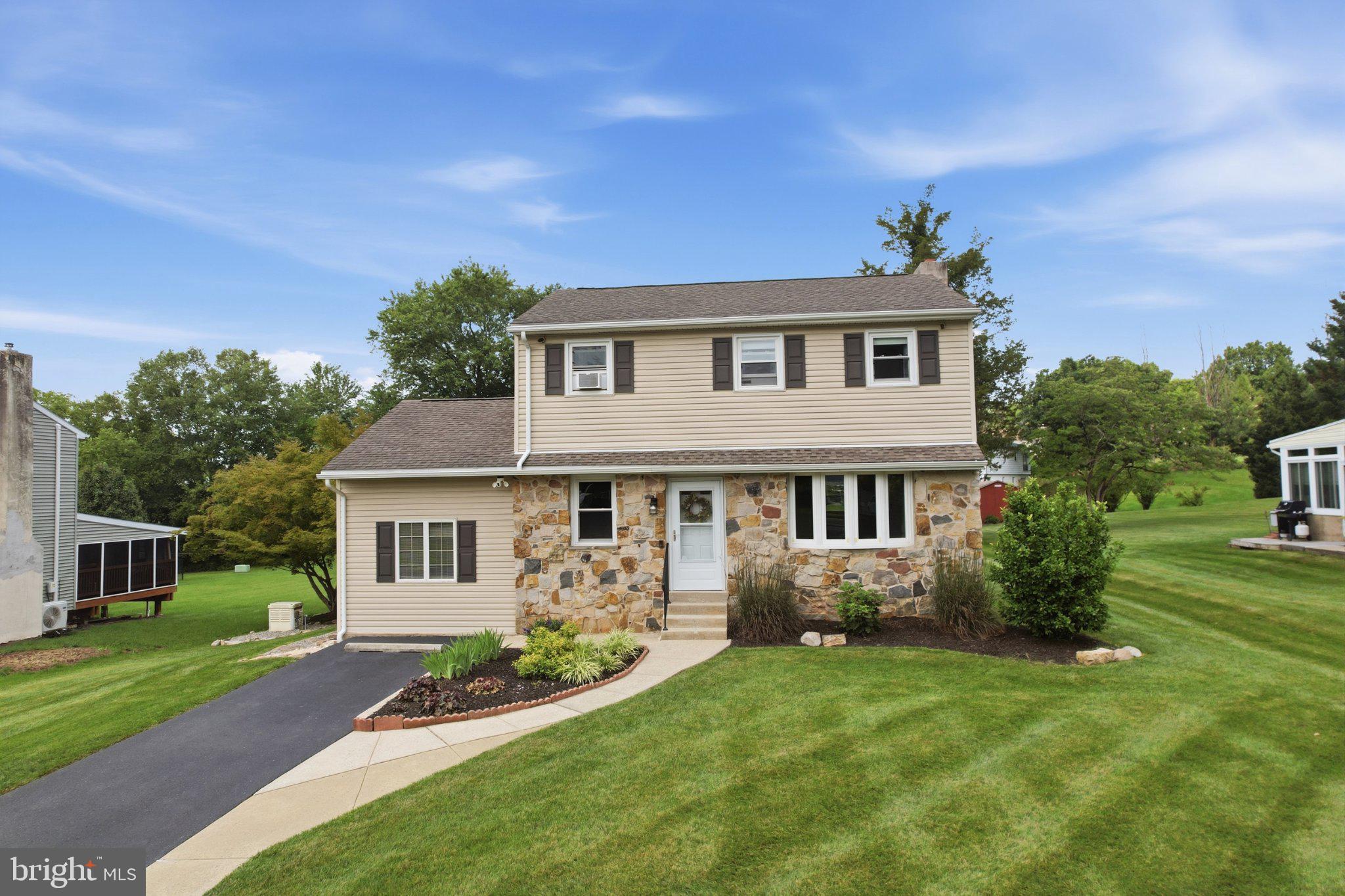 1385 Woodmere Road Pottstown, PA 19464 - Photo 1 of 63 Charming home with lush green surroundings.