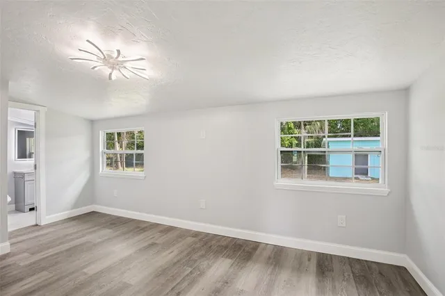 a bathroom with a shower sink and mirror