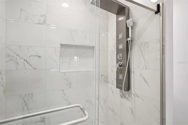 a view of a small space with wooden floor and a window