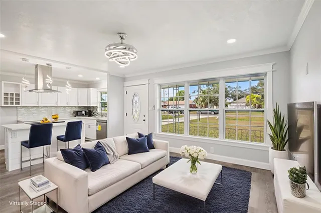 a kitchen with a stove a sink and a refrigerator