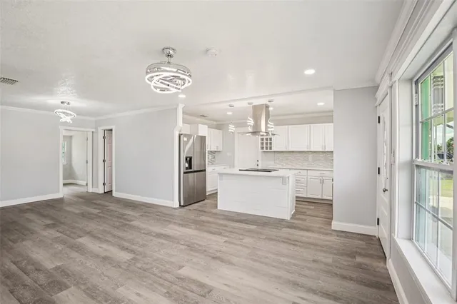 a view of staircase with white walls and empty racks