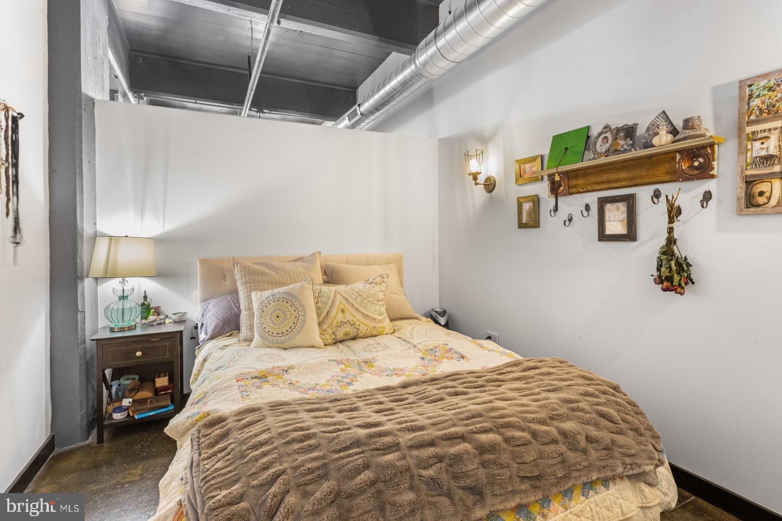 1701 Tulip Street, Unit LL2 Philadelphia, PA 19125 - Photo 15 of 27 a bedroom with a bed and a night stand