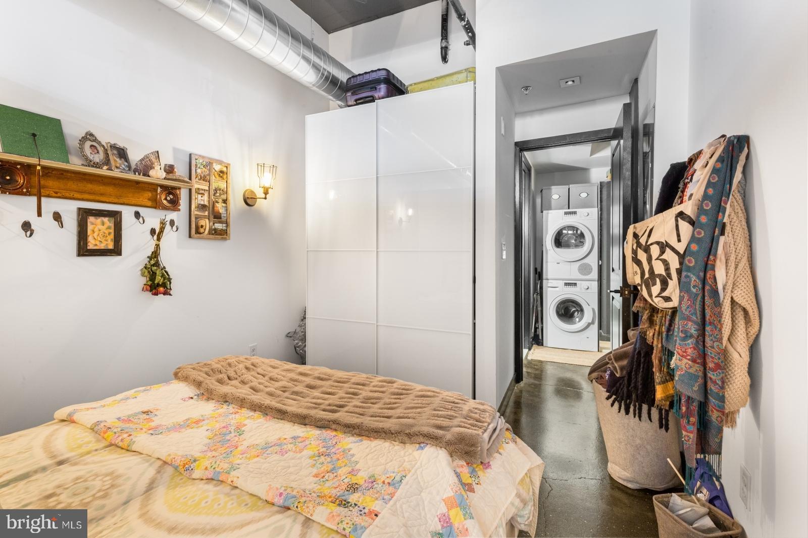 1701 Tulip Street, Unit LL2 Philadelphia, PA 19125 - Photo 17 of 27 a bedroom with a bed and a mirror