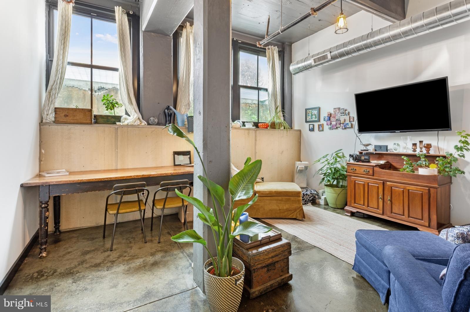 1701 Tulip Street, Unit LL2 Philadelphia, PA 19125 - Photo 2 of 27 a living room with furniture and a flat screen tv