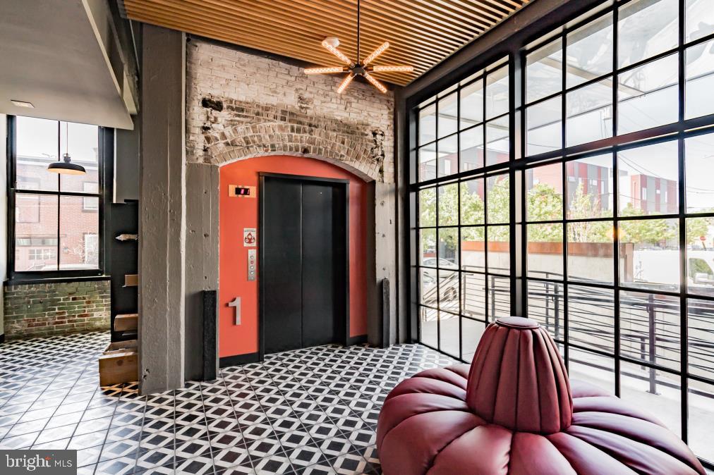 1701 Tulip Street, Unit LL2 Philadelphia, PA 19125 - Photo 21 of 27 a bedroom with a bed and a large window