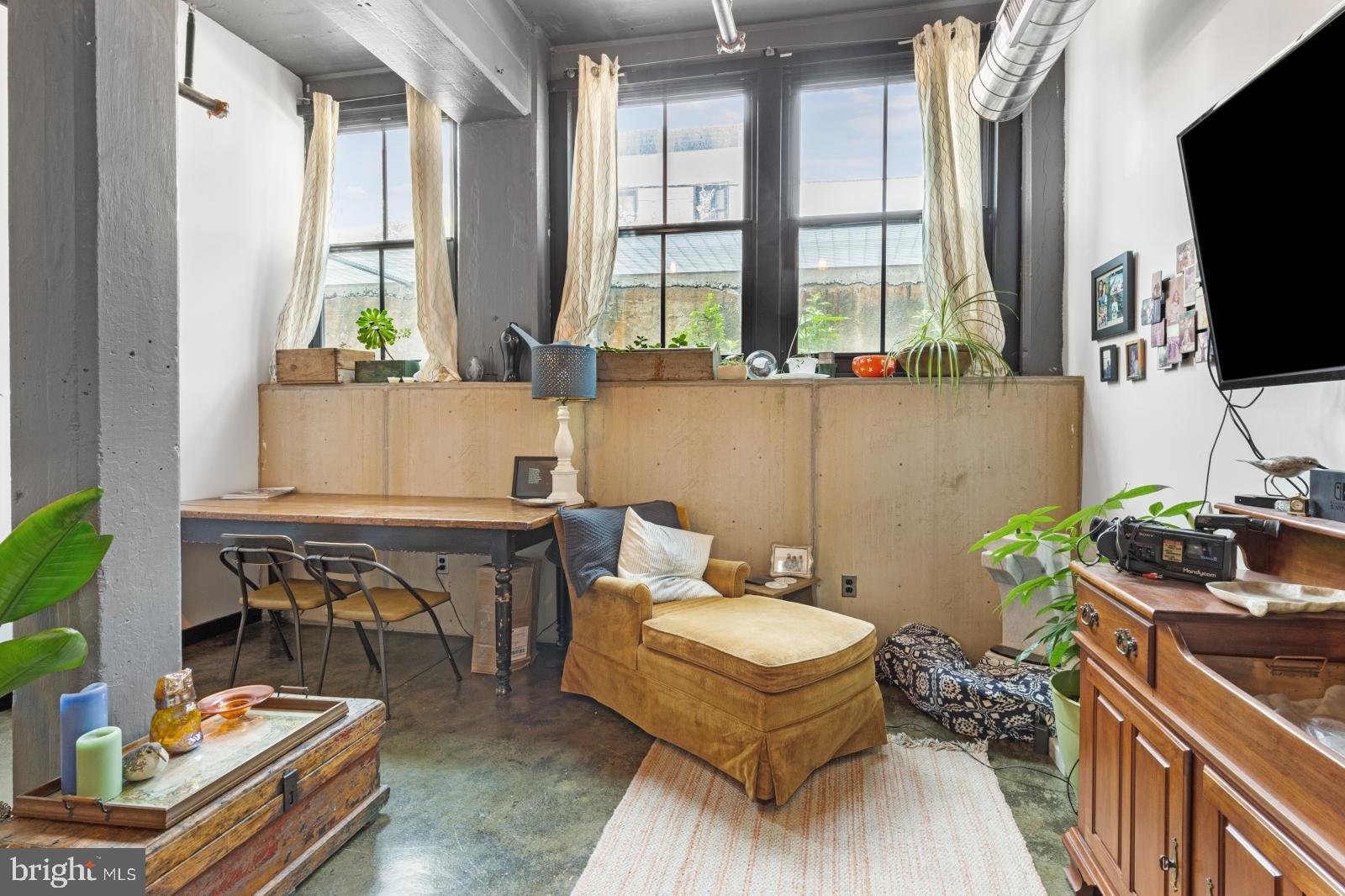 1701 Tulip Street, Unit LL2 Philadelphia, PA 19125 - Photo 5 of 27 a bathroom with a sink a mirror and a window