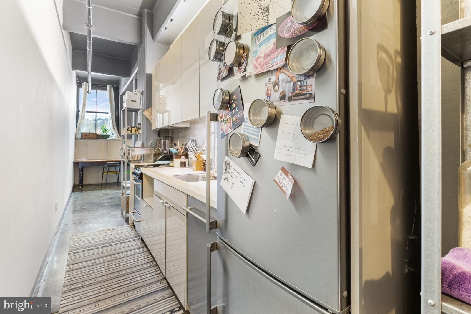 1701 Tulip Street, Unit LL2 Philadelphia, PA 19125 - Photo 7 of 27 a kitchen with stainless steel appliances granite countertop a refrigerator and a stove