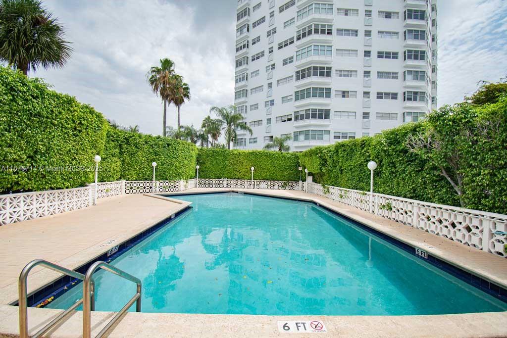 1881 Washington Avenue, Unit 15C Miami Beach, FL 33139 - Photo 21 of 30 a view of a swimming pool with an outdoor seating