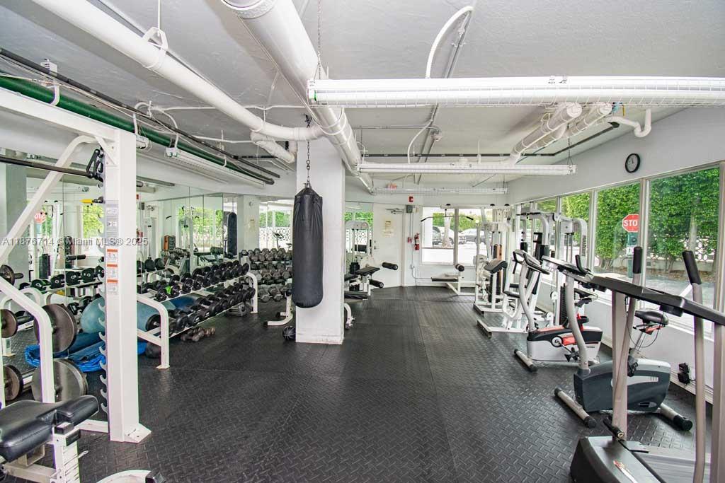1881 Washington Avenue, Unit 15C Miami Beach, FL 33139 - Photo 23 of 30 a view of a room with gym equipment