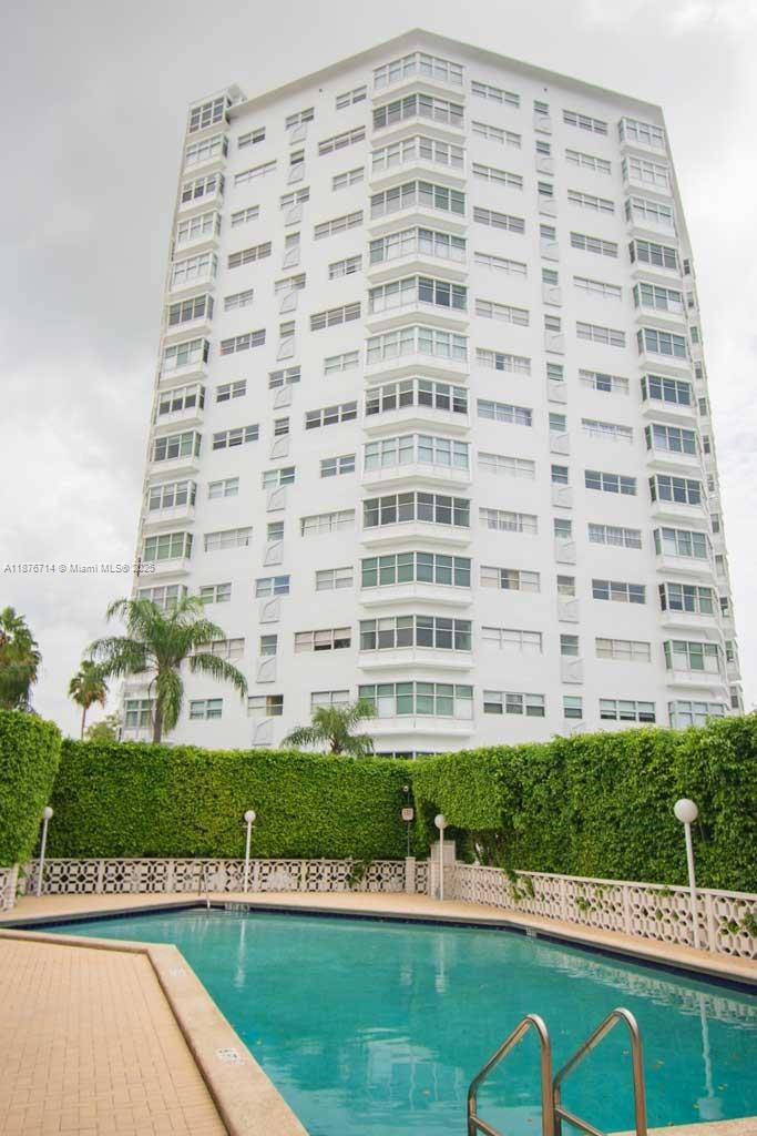 1881 Washington Avenue, Unit 15C Miami Beach, FL 33139 - Photo 25 of 30 a front view of a building with a yard