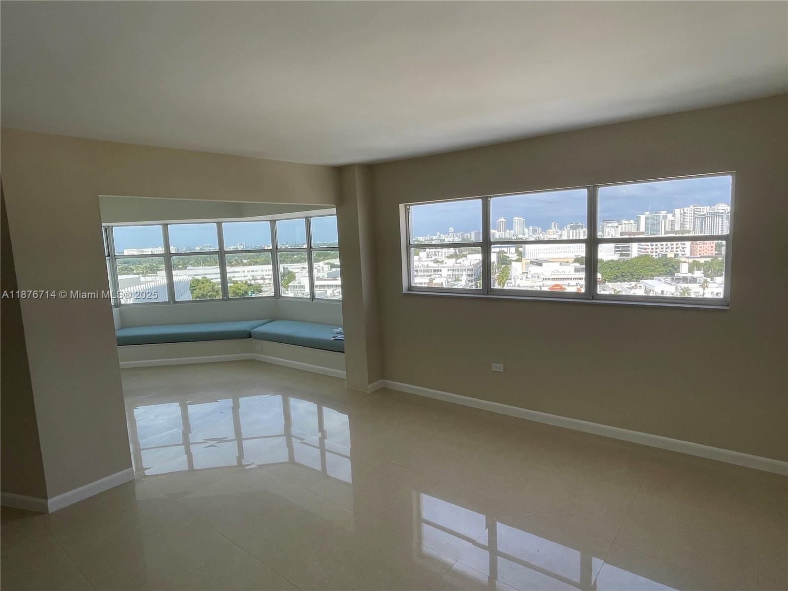 1881 Washington Avenue, Unit 15C Miami Beach, FL 33139 - Photo 6 of 30 an empty room with windows