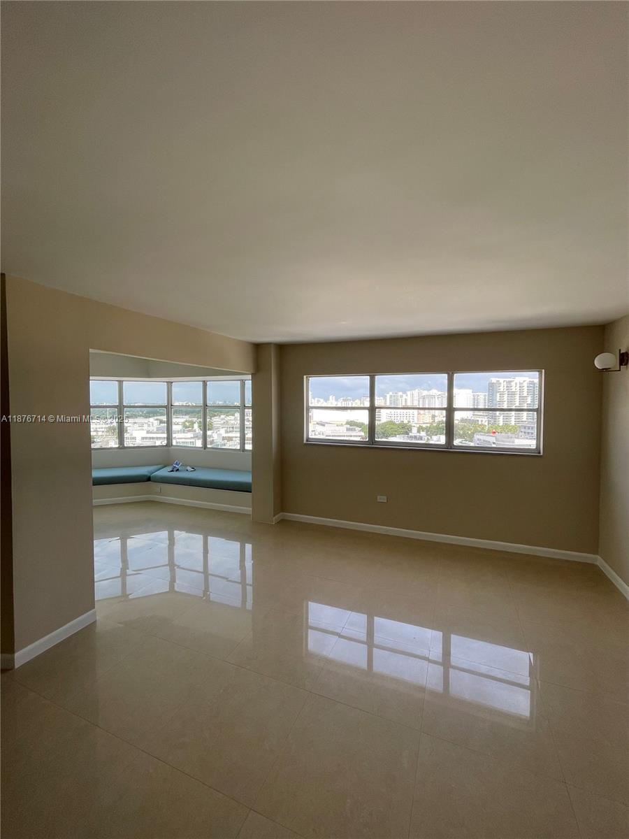 1881 Washington Avenue, Unit 15C Miami Beach, FL 33139 - Photo 9 of 30 an empty room with windows