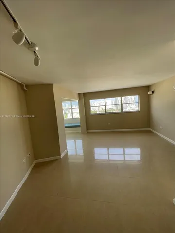 a view of empty room with windows