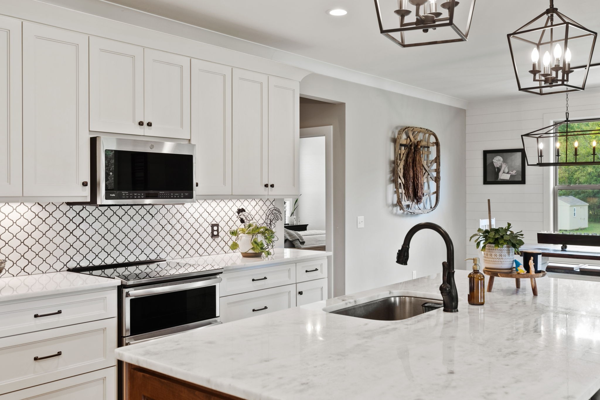 5651 Flewellyn Road Springfield, TN 37172 - Photo 11 of 55 a kitchen with a sink and a stove with wooden floor