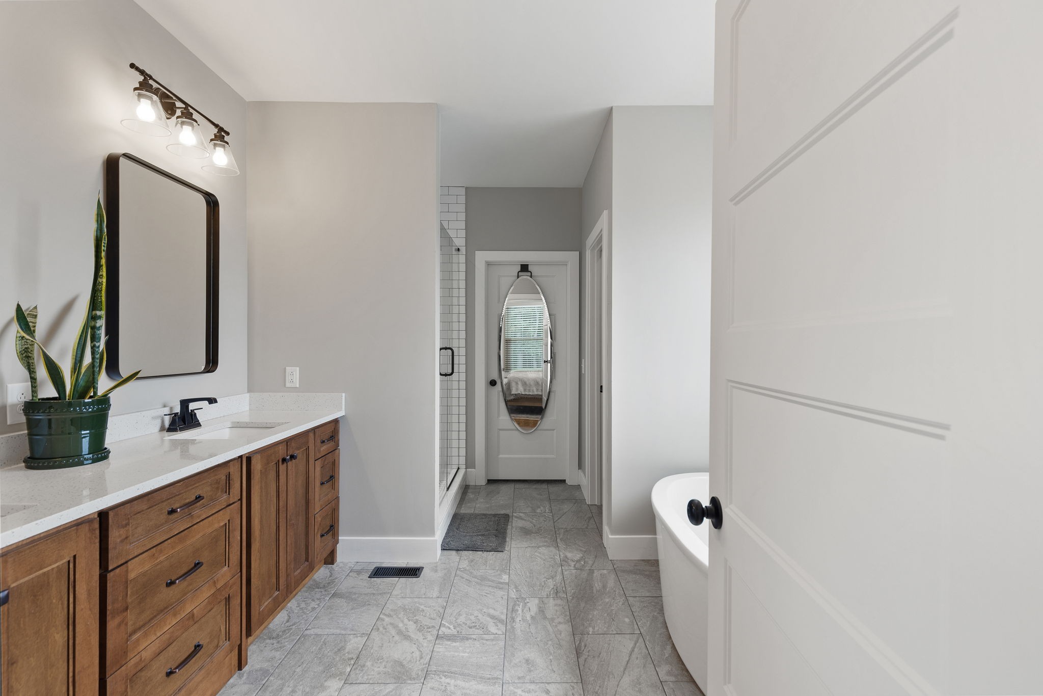 5651 Flewellyn Road Springfield, TN 37172 - Photo 23 of 55 a spacious bathroom with a double vanity sink a mirror and a shower