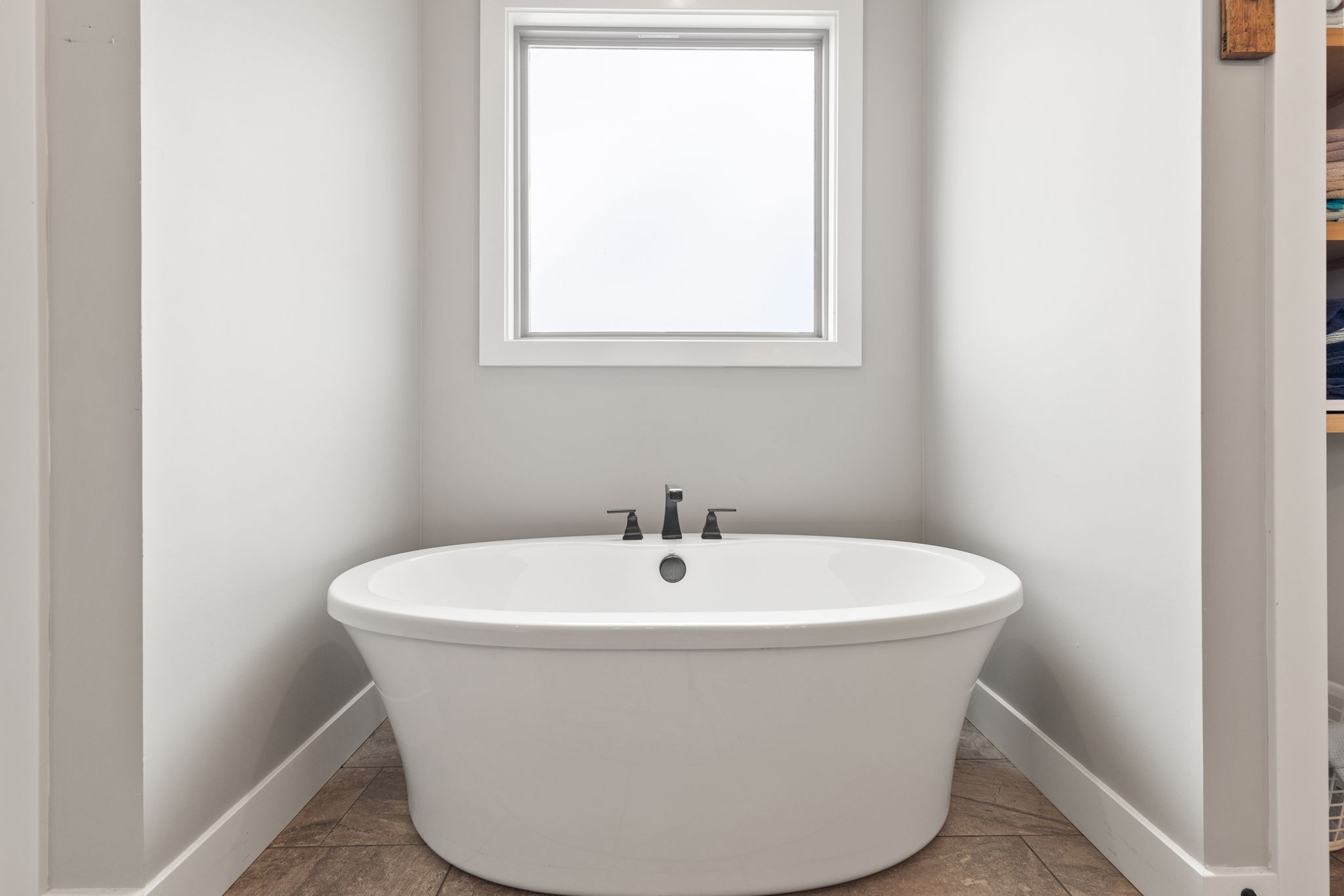 5651 Flewellyn Road Springfield, TN 37172 - Photo 25 of 55 a white bath tub sitting in a bathroom