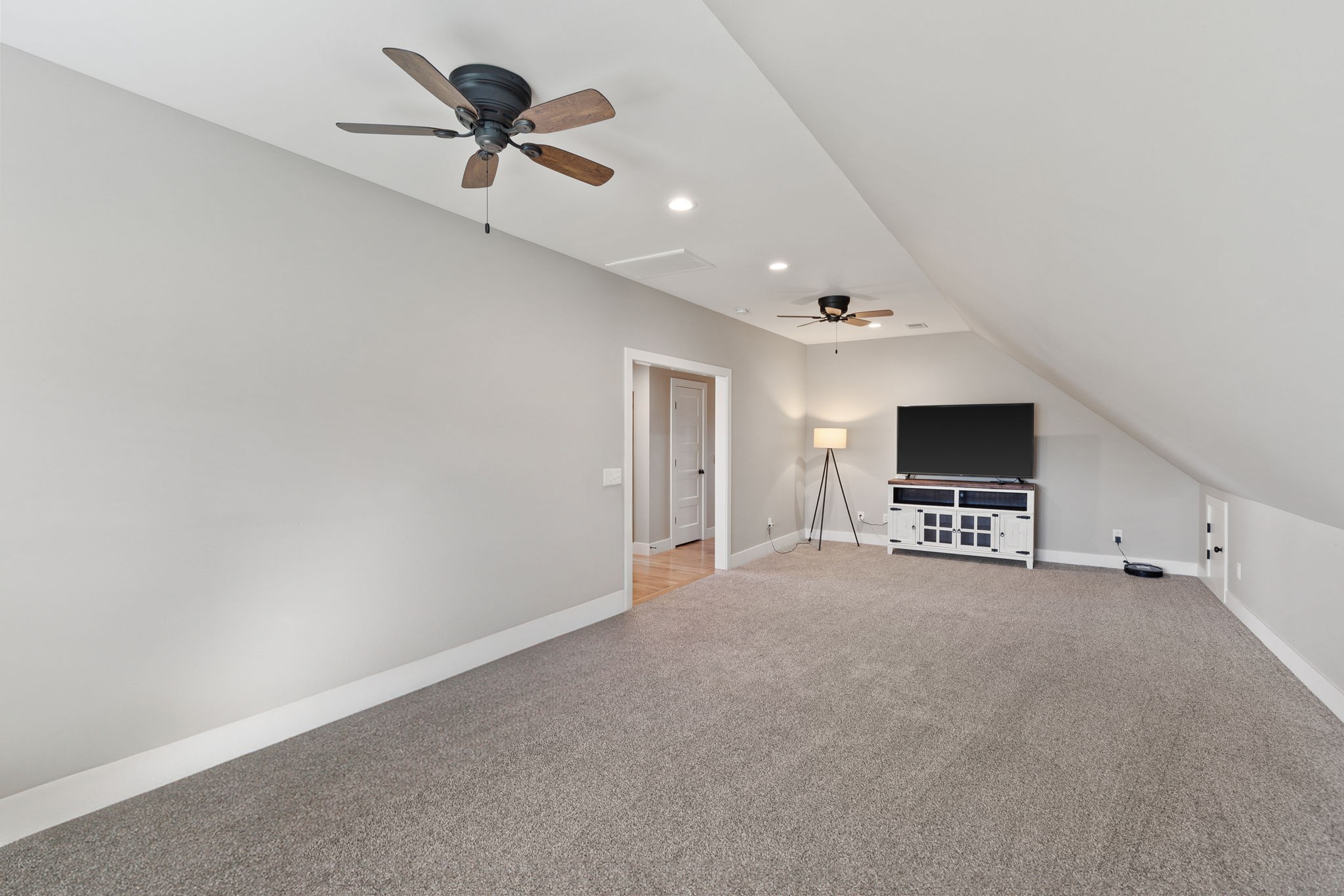 5651 Flewellyn Road Springfield, TN 37172 - Photo 32 of 55 a view of a livingroom with a flat screen tv and ceiling fan