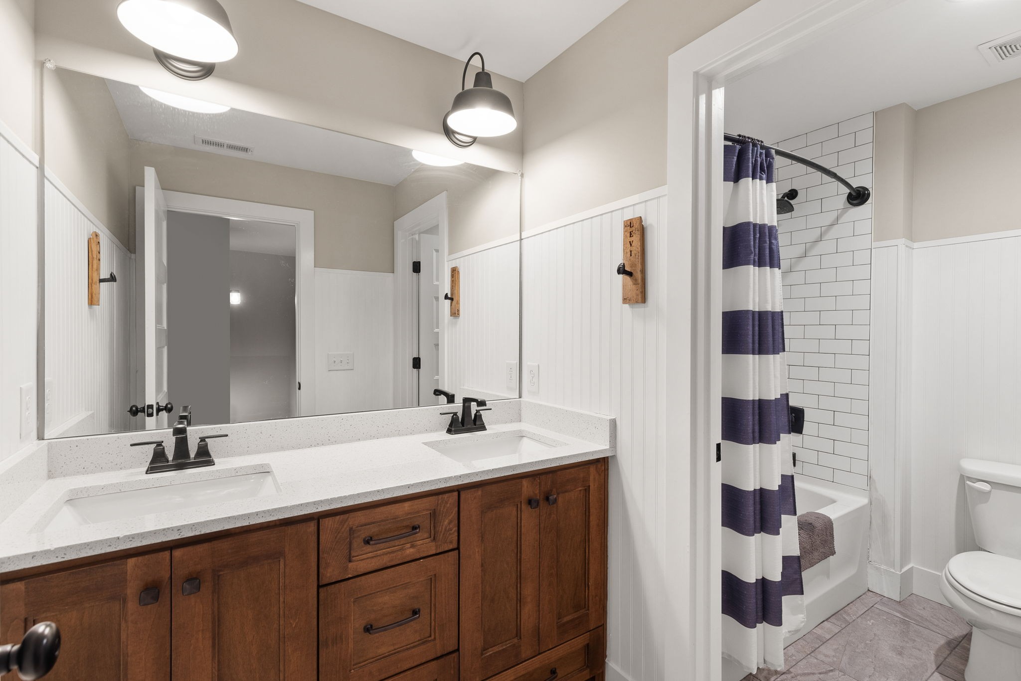 5651 Flewellyn Road Springfield, TN 37172 - Photo 36 of 55 a bathroom with a double vanity sink toilet and shower