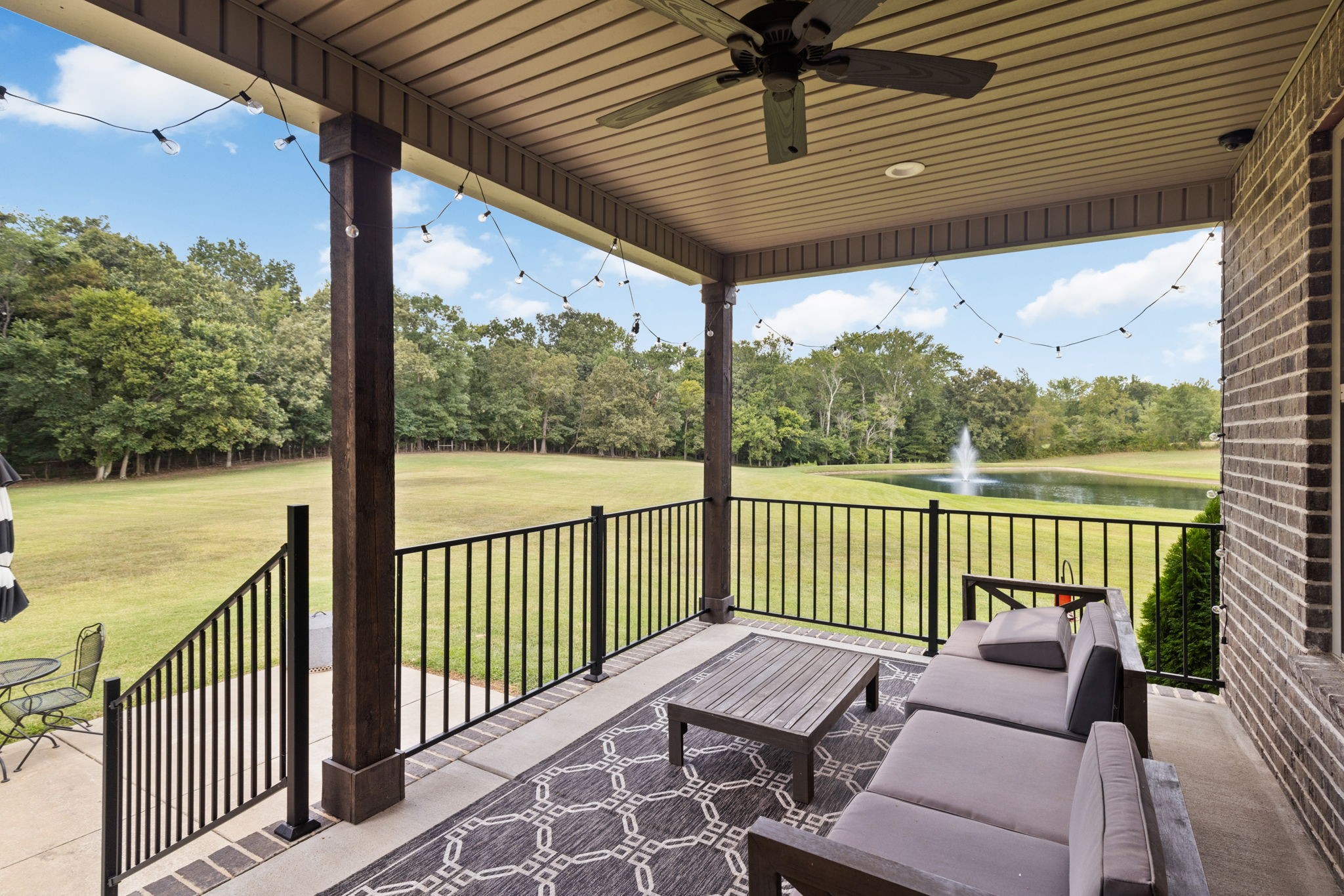 5651 Flewellyn Road Springfield, TN 37172 - Photo 42 of 55 a balcony with furniture and wooden floor
