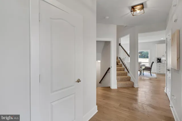 a view of an entryway with wooden floor and stairs