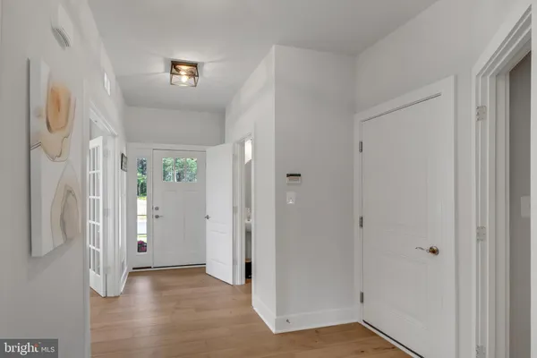 a view of entryway with bathroom