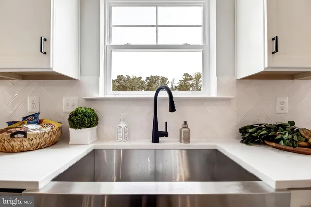 a kitchen with sink and window