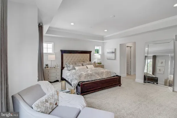 a bedroom with a bed and a couch