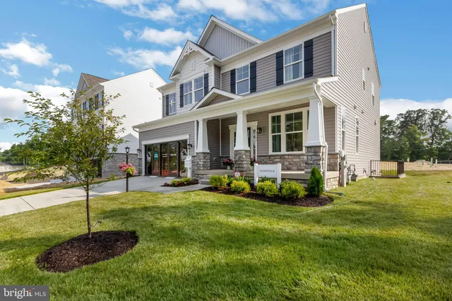 a view of a house with a backyard porch and sitting area